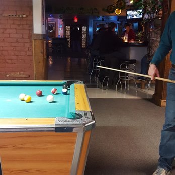 The Establishment - a man playing pool in a bar - Bars Near Me - Grangeville, Idaho The Establishment - a man playing pool in a bar - Bars Near Me - Grangeville, Idaho