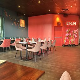 a dining room with tables and chairs a dining room with tables and chairs