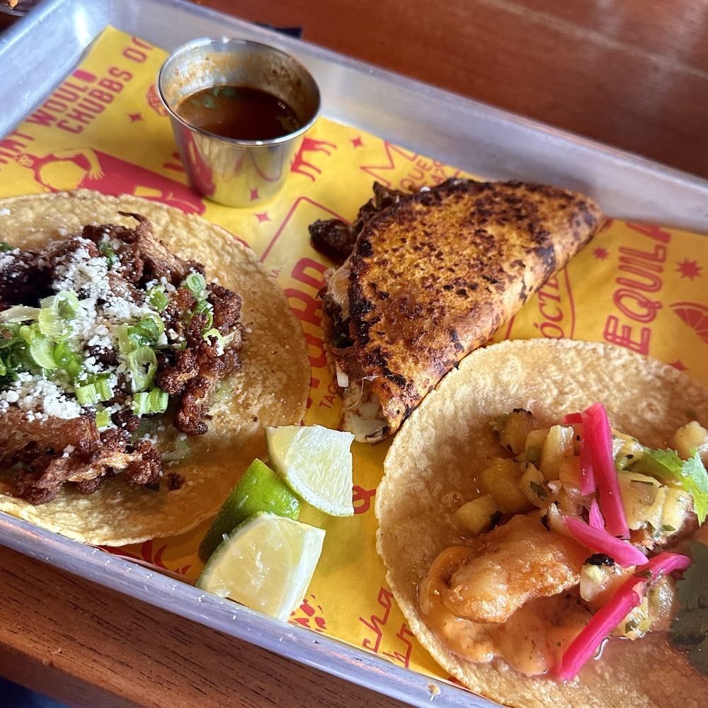 Cauliflower taco, birria taco, drunken fish taco Cauliflower taco, birria taco, drunken fish taco