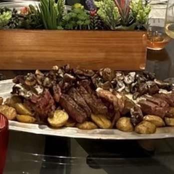 A Bit of Grace - Seared steaks with garlic sherry mushrooms and béarnaise sauce served over baby roasted Yukon gold potatoes - Caterers Near Me
