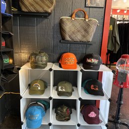 a variety of hats on display a variety of hats on display