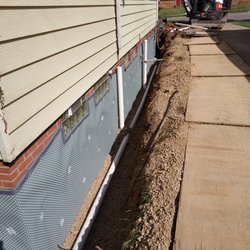 JD Johnson Waterproofing - Clean puts on evert side of the house. They clean up their work area each day.