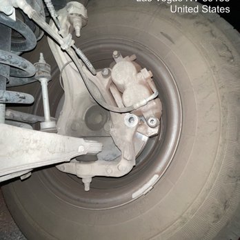Midas - The dislodged bolts on my brake caliper holding my tire to my truck. - Auto Repair Near Me - Henderson, Nevada Midas - The dislodged bolts on my brake caliper holding my tire to my truck. - Auto Repair Near Me - Henderson, Nevada