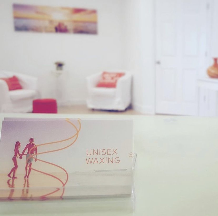 The Wax Whisperers Logo