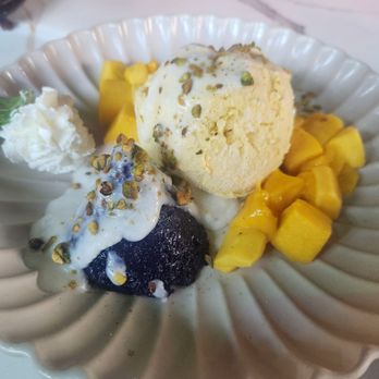 B.O.T - Butterfly pea sticky rice with mango ice cream and cream, topped with pistachios - Salad Near Me - Atlanta, Georgia
