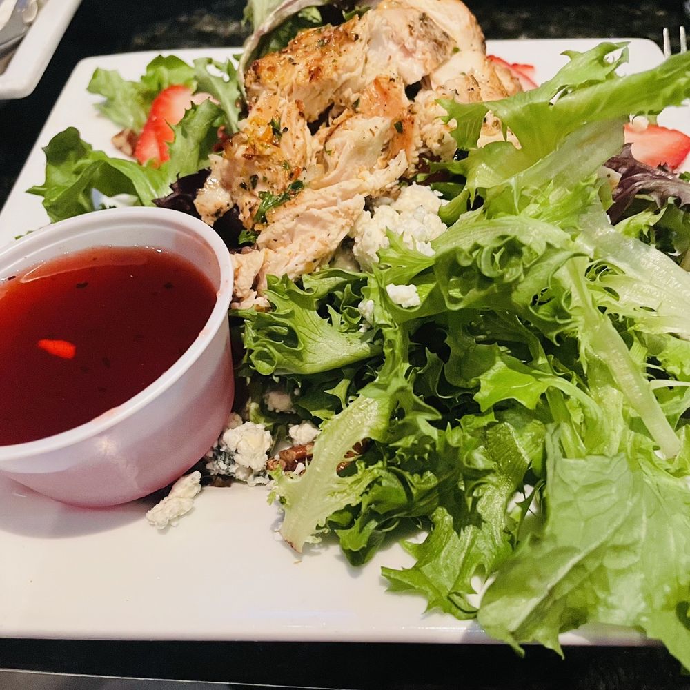 Jonathan's Grille - The 1/2 signature salad with fat free raspberry vinaigrette, grilled chicken, strawberries, candied pecans and blue cheese crumbles. - Pizza Near Me - Hendersonville, Tennessee Jonathan's Grille - The 1/2 signature salad with fat free raspberry vinaigrette, grilled chicken, strawberries, candied pecans and blue cheese crumbles. - Pizza Near Me - Hendersonville, Tennessee