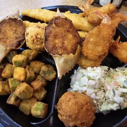 Captain D's - Deluxe Seafood Platter: two fish fillets, six shrimp, two seafood stuffed crab shells with your choice of two sides and hush puppies.
