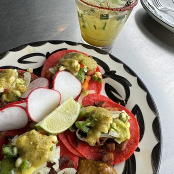 Kalaveras - Happy hour + taco Tuesday. Jalapeño cucumber margarita with assortment of tacos: barbacoa, al pastor, asada, and sweet potato. - Cocktail Bars Near Me - Pasadena, California