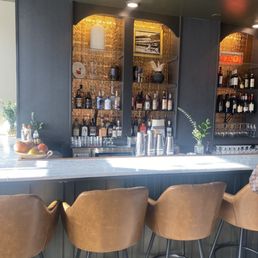 a row of chairs at a bar a row of chairs at a bar