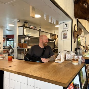 Marbled Meat Shop - a man working behind a counter - Butcher Near Me - Cold Spring, New York