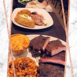 Smoke Modern Barbeque - Pulled pork, loaded baked potato and house baked beans and full slab of ribs with house made baked beans and Mac-n-cheese