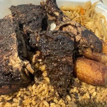 Caribbean Kitchen - Large jerk chicken dinner  Jerk chicken, cabbage, peas and rice & plantains Beef patty - Caribbean Near Me - Fort Worth, Texas