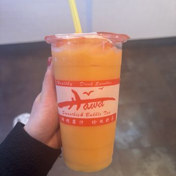 Hawa Smoothies & Bubble Tea - a person holding a plastic cup - Bubble Tea Near Me - New York, New York Hawa Smoothies & Bubble Tea - a person holding a plastic cup - Bubble Tea Near Me - New York, New York