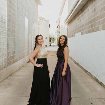 Gown Town - Classic black or regal plum, either look hits the mark. - Women's Clothing Near Me - North Logan, Utah Gown Town - Classic black or regal plum, either look hits the mark. - Women's Clothing Near Me - North Logan, Utah