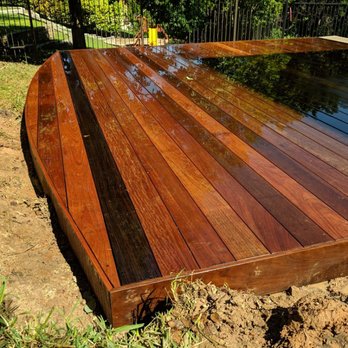 Custom Deck and Fence - Custom ipe pool deck we installed.  Gorgeous curves! - Pressure Washers Near Me