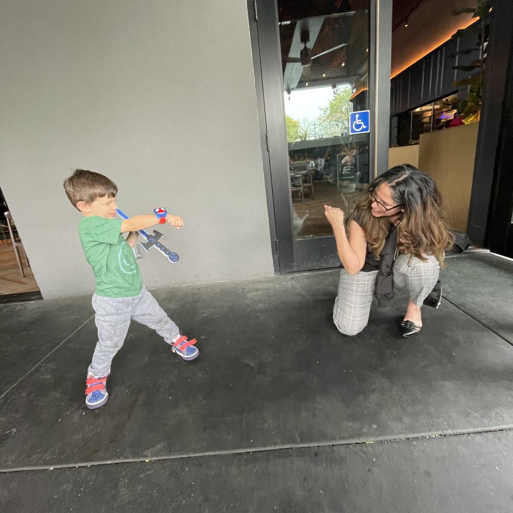 La Popular - 3 year old enjoying another patron playing with him!! - Cocktail Bars Near Me - Claremont, California