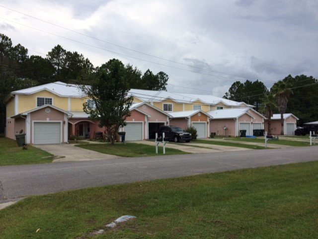 Slide of Greg's Roofing Of Bay County
