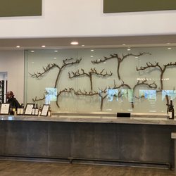 The Grill - Wine tasting area decorated with grapes branches