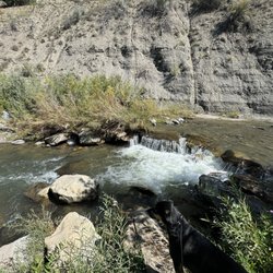 Last Resort RV Park and Campground - Little waterfall in the river on campground