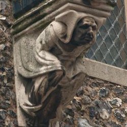 St. George's Tower - The gargoyle under the clock.