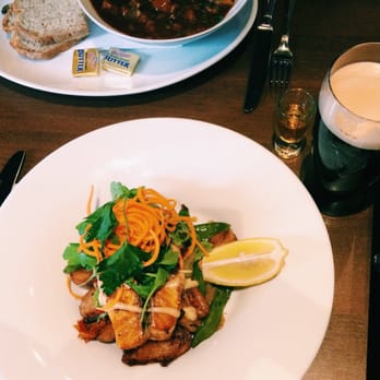 The Old Mill Restaurant - Salmon and roasted potatoes and a corner of my buddy's Guinness Stew with brown bread! - Seafood Near Me - Dublin, D The Old Mill Restaurant - Salmon and roasted potatoes and a corner of my buddy's Guinness Stew with brown bread! - Seafood Near Me - Dublin, D