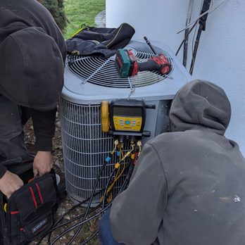 Huntington Air Conditioning - Huntington air conditioning team working on a outside condenser - Plumbing Near Me - Huntington, New York Huntington Air Conditioning - Huntington air conditioning team working on a outside condenser - Plumbing Near Me - Huntington, New York