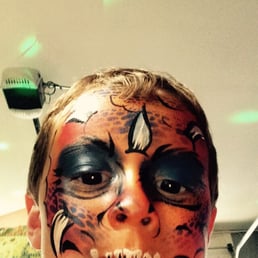 My son taking a selfie of his new dinosaur look! My son taking a selfie of his new dinosaur look!