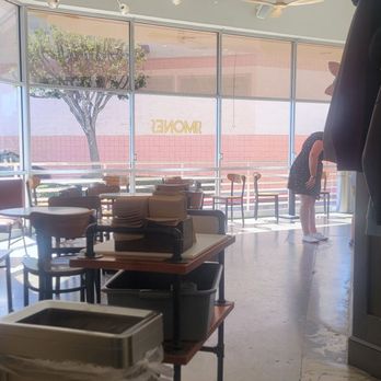 Simones Coffee & Tea - Front seating of shop with their little stand to pick up your order. - Coffee & Tea Near Me - Ventura, California Simones Coffee & Tea - Front seating of shop with their little stand to pick up your order. - Coffee & Tea Near Me - Ventura, California