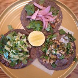 three tacoss on a plate three tacoss on a plate