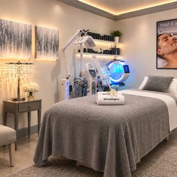 Isarat's Men's Spa - "Private facial treatment room at ISARAT'S Men's Spa, designed for professional men's skincare in a clean and relaxing environment."