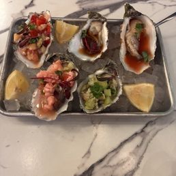 Oyster flight. So good! The ceviche one and the pineapple one were our favs! Oyster flight. So good! The ceviche one and the pineapple one were our favs!