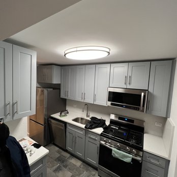 ENE construction - a kitchen with stainless steel appliances - Flooring Near Me - New York, New York ENE construction - a kitchen with stainless steel appliances - Flooring Near Me - New York, New York