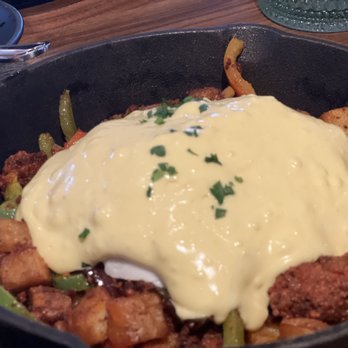 Julep Cast Iron Kitchen + Drink - Close up of the poached egg on the Julep Benedict. - New American Near Me - Brea, California Julep Cast Iron Kitchen + Drink - Close up of the poached egg on the Julep Benedict. - New American Near Me - Brea, California
