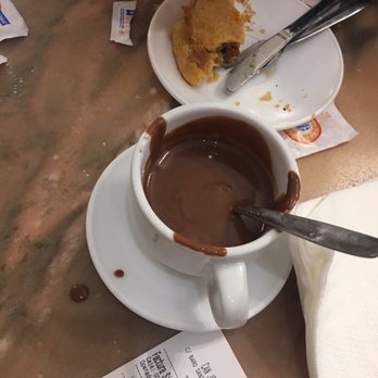Ca'n Joan de S'aigo - The hot chocolate is more like a thick syrup? It's for dipping not sipping. Also pictured is the beef empanada, very good - Ice Cream & Frozen Yogurt Near Me - Palma, PM