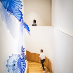 Visitors on the feature staircase at the Palmer Museum of Art