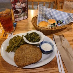 Cracker Barrel Old Country Store - The country fried steak with green beans, turnip greens, biscuits, and an unsweet tea.