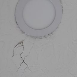 A dent appeared in our roof after they walked on our roof, which they did patch after a 3 weeks.