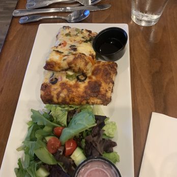Pecos Flavors Winery + Bistro - Pizza with salad and onion vinaigrette - Wineries Near Me - Roswell, New Mexico