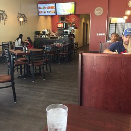 The restaurant. Seating gives you a menu but they also have an order board. The restaurant. Seating gives you a menu but they also have an order board.