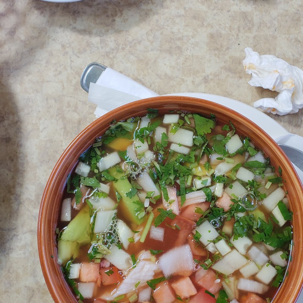 Seafood soup with avocado, onions and tomatoes Seafood soup with avocado, onions and tomatoes