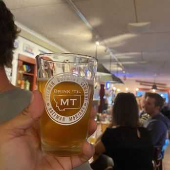 Bozeman Brewing Company - a man holding a beer glass - Breweries Near Me - Bozeman, Montana Bozeman Brewing Company - a man holding a beer glass - Breweries Near Me - Bozeman, Montana