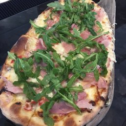 Prosciutto pizza with roasted red peppers and arugula was one of the best flatbreads I've ever had. Prosciutto pizza with roasted red peppers and arugula was one of the best flatbreads I've ever had.