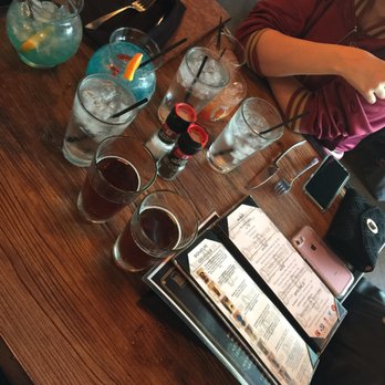 Fireside Foundry - Small table considering there were 4 of us, we each had 2-for-1 drinks plus water and the menus are quite large. - Pizza Near Me - Richfield, Minnesota