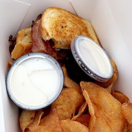 a box of chips and a sandwich