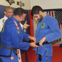 617 Fight Sports - David Salim receiving his Black Belt from Professors Neto and Silverio