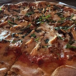 Created own pizza-grilled chicken, sun dried tomatoes, bacon, basil with red sauce.