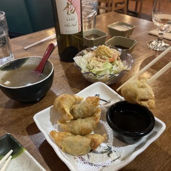 Sake Japanese Restaurant - a plate of food and a bottle of wine - Sushi Bars Near Me - Beavercreek, Ohio Sake Japanese Restaurant - a plate of food and a bottle of wine - Sushi Bars Near Me - Beavercreek, Ohio