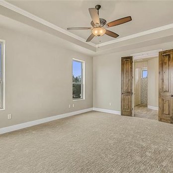 Creative Homes - a large empty room with a ceiling fan - General Contractors Near Me - Canyon Lake, Texas Creative Homes - a large empty room with a ceiling fan - General Contractors Near Me - Canyon Lake, Texas
