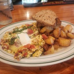 Sunshine Scramble with a side of potatoes and wheat toast