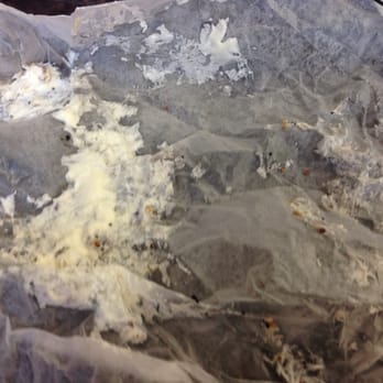 Sunset Bagels - The wrapping of the bagel, doused in liquid cream cheese, after it was microwaved. - Bagels Near Me - Brooklyn, New York Sunset Bagels - The wrapping of the bagel, doused in liquid cream cheese, after it was microwaved. - Bagels Near Me - Brooklyn, New York